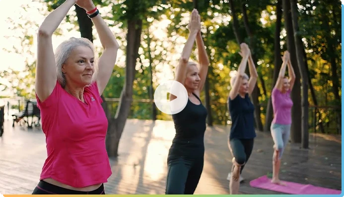 Women doing yoga at a park